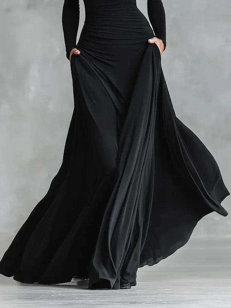 Modern long black crepe dress with pleated boat neckline